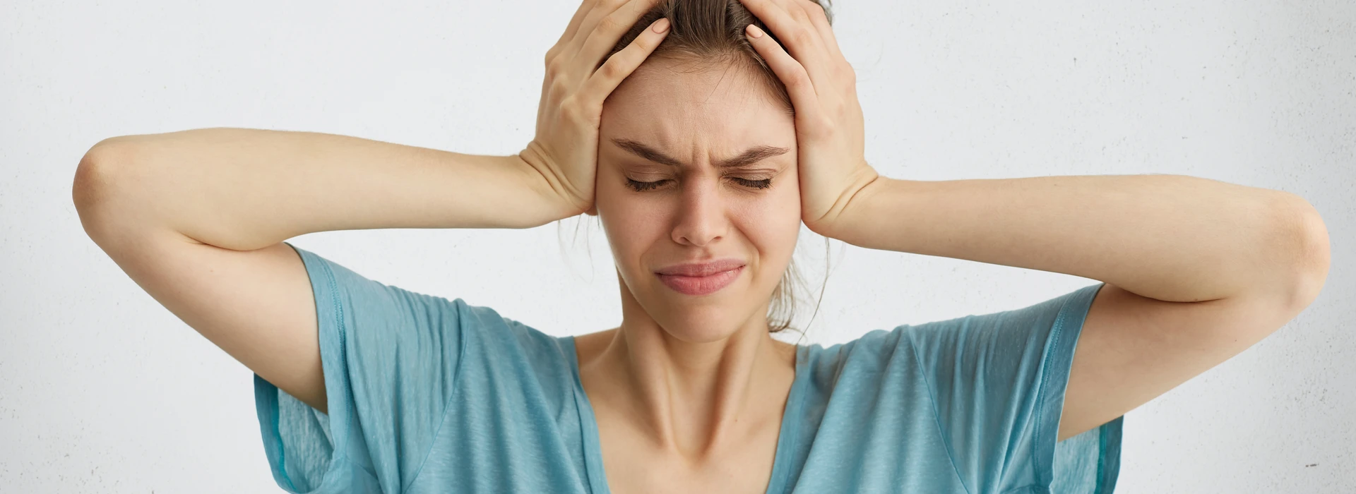 worried-woman-closing-her-eyes-with-hands-head-banner