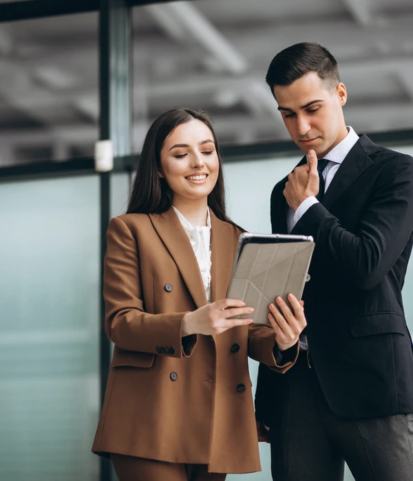 male-female-business-people-working-tablet-office-page