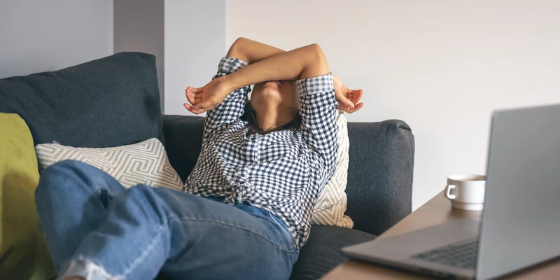 tired-from-work-young-woman-front-laptop-blog